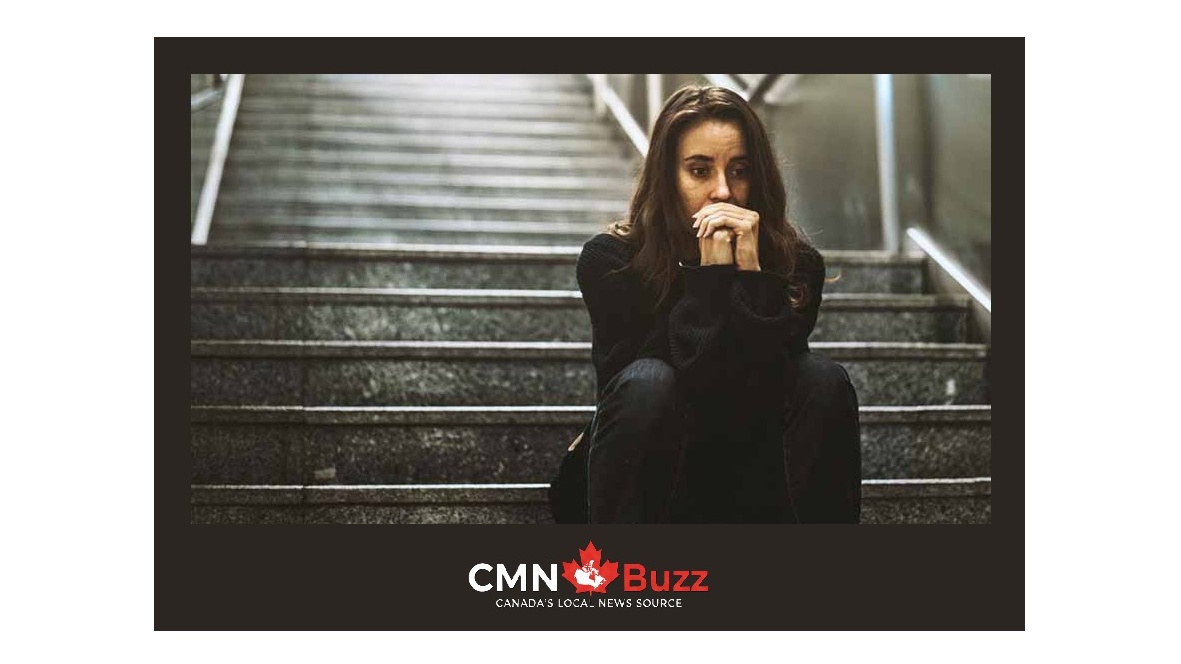 A young woman looking distressed, symbolizing mental health struggles like anxiety and low self-esteem, featuring the CMN Buzz logo.